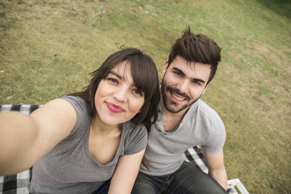 Couple smiling together outdoors